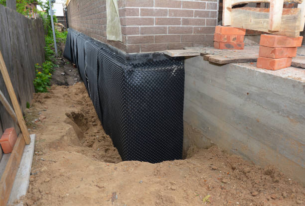 Happy homeowners after waterproofing job in Hampton